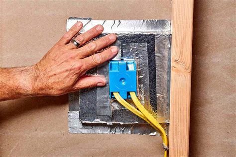 dark colored insulation around electrical boxes|insulation for circuit breaker box.